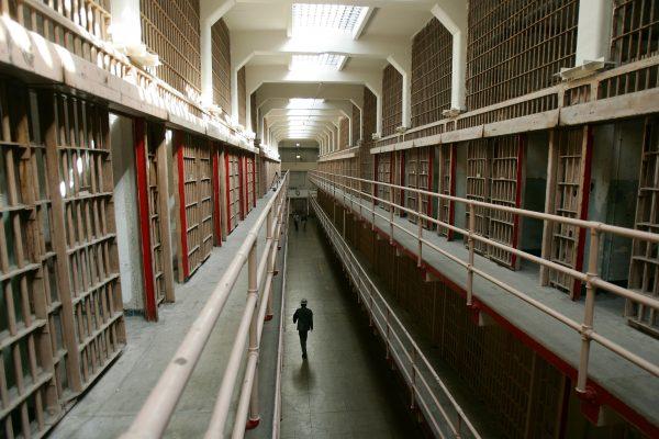 A National Park Service ranger walks down "Broadway" in the main cell block on Alcatraz Island in San Francisco Bay on June 14, 2007. (Robyn Beck/AFP/Getty Images)