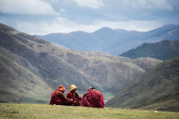 Tibetan monks sitting in a neighboring valley near the Larung Gar Buddhist Academy, on May 29, 2017. (Johannes Eisele/AFP/Getty Images)