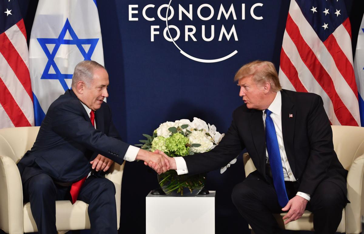 President Donald Trump shakes hands with Israel's Prime Minister Benjamin Netanyahu during a bilateral meeting on the sidelines of the World Economic Forum (WEF) annual meeting in Davos, eastern Switzerland, on January 25, 2018. (NICHOLAS KAMM/AFP/Getty Images)