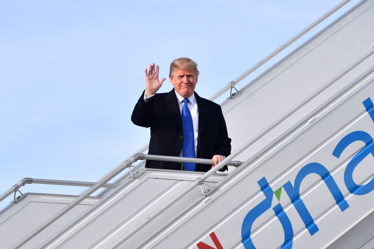 President Donald Trump waves as he arrives in Zurich en route to the World Economic Forum (WEF) in Davos, Switzerland, on Jan. 25, 2018. (NICHOLAS KAMM/AFP/Getty Images)