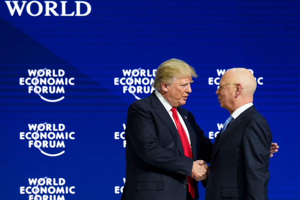President Trump shakes hands with Klaus Schwab, WEF founder and executive chairman, in Davos, on Jan. 26, 2018. (FABRICE COFFRINI/AFP/Getty Images)
