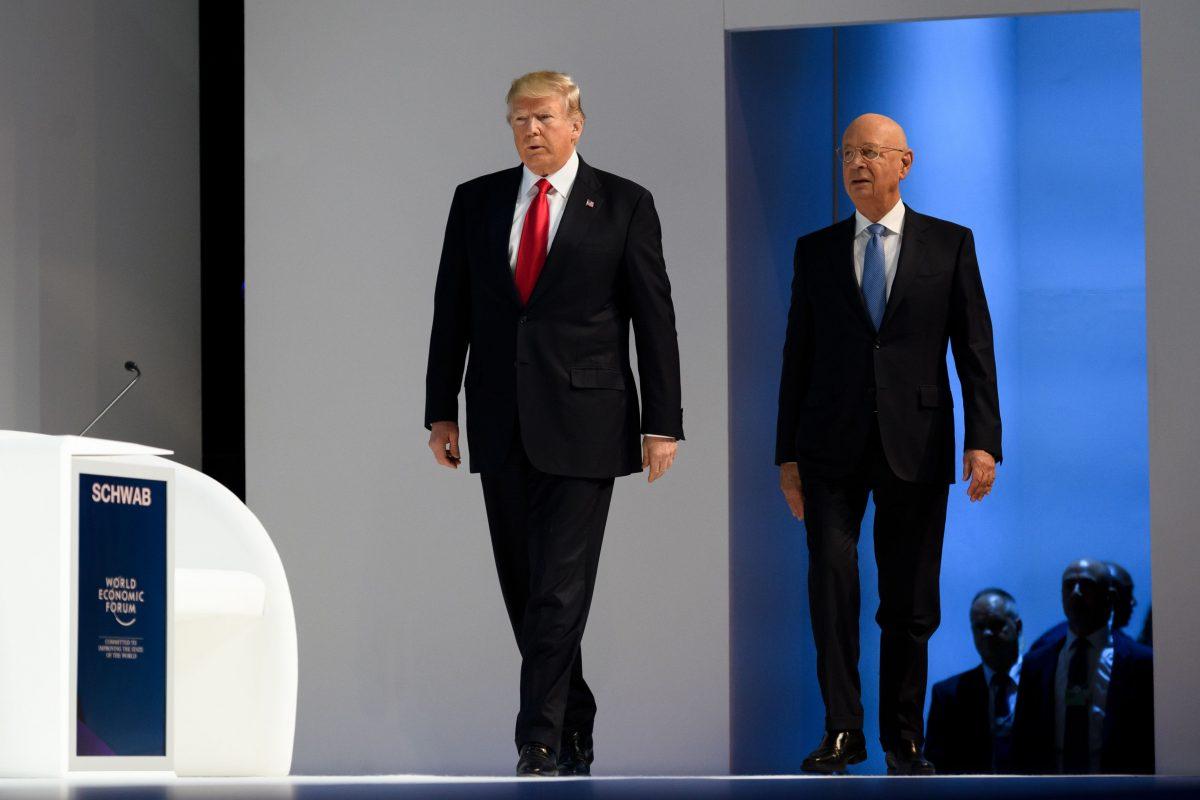 President Trump and Klaus Schwab, WEF founder and executive chairman, arrive at the WEF annual meeting in Davos, on Jan. 26, 2018. (FABRICE COFFRINI/AFP/Getty Images)