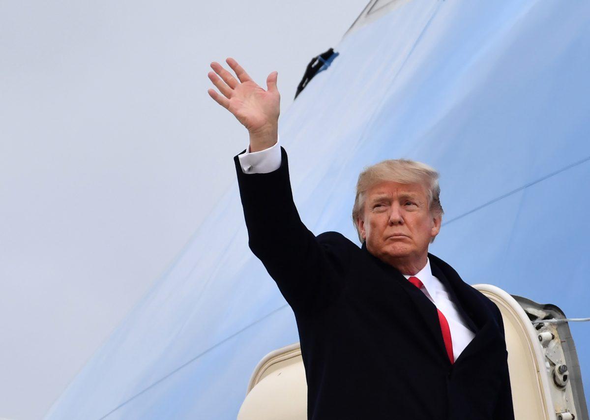 President Trump waves before boarding Air Force One ahead of his departure from Zurich Airport in Switzerland, on Jan. 26, 2018. (NICHOLAS KAMM/AFP/Getty Images)
