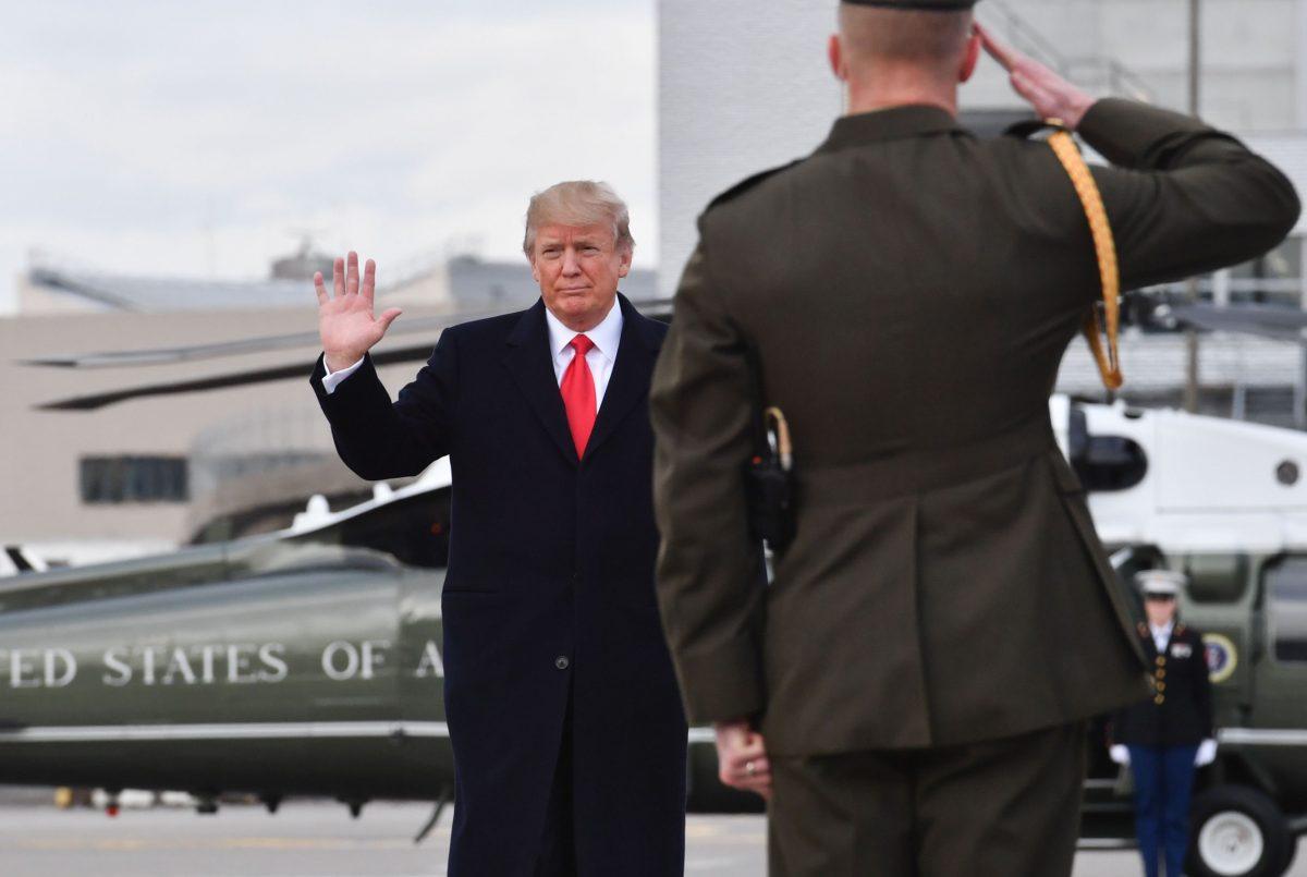 President Trump waves before departing Zurich Airport on Jan. 26, 2018. (NICHOLAS KAMM/AFP/Getty Images)