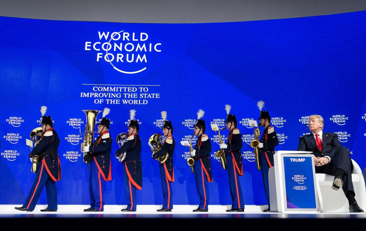 President Trump watches as the Landwehr Fribourg band leaves the stage during the WEF annual meeting in Davos, on Jan. 26, 2018. (FABRICE COFFRINI/AFP/Getty Images)