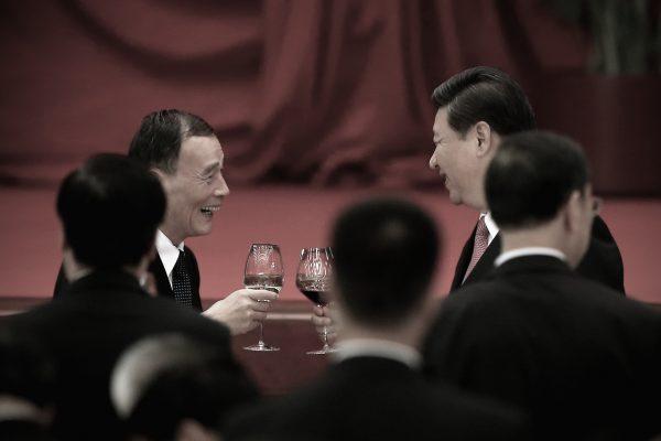Chinese leader Xi Jinping (R) and Wang Qishan toast with high-ranking Chinese officials at a dinner marking the 64th anniversary of the Chinese Communist Party's takeover of China, at the Great Hall of the People in Beijing on September 30, 2013. (Feng Li/Getty Images)
