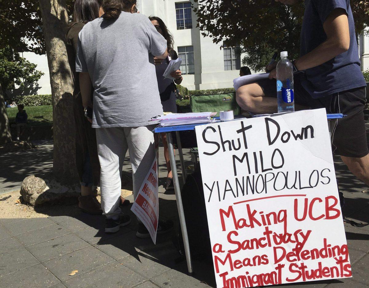 A booth calls for protesters to “shut down” controversial right-wing commentator Milo Yiannopoulos, on Sproul Plaza at the University of California, Berkeley, on Sept. 21, 2017. (Jocelyn Gecker/AP Photo)
