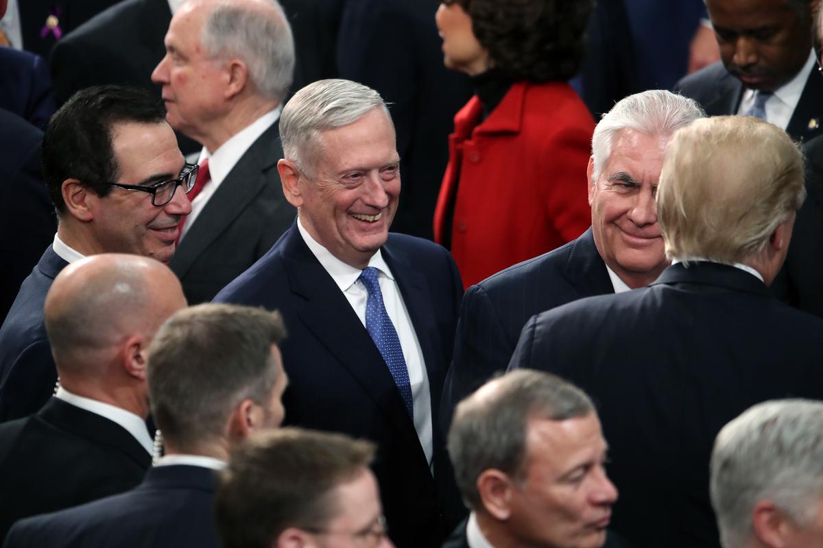 (L-R) Secretary of the Treasury Steven Mnuchin, Secretary of Defense Gen. Jim Mattis, U.S. Secretary of State Rex Tillerson greet President Donald J. Trump as he arrives during the State of the Union address in the chamber of the U.S. House of Representatives Jan. 30, 2018. (Mark Wilson/Getty Images)