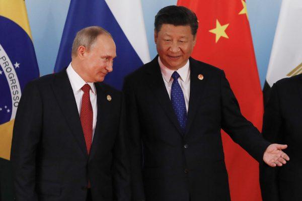 Chinese President Xi Jinping (R) and Russian President Vladimir Putin in Xiamen, southeastern China's Fujian Province, on Sept. 5, 2017. (Tyrone Siu/AFP/Getty Images)