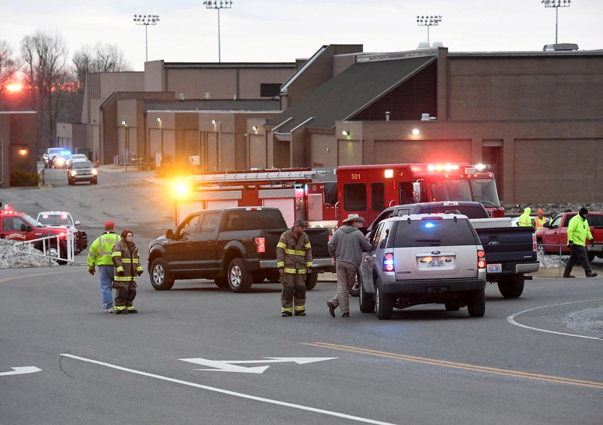 Police investigators are seen at the scene of a shooting at Marshall County High School in Benton, Kentucky on Jan. 23, 2018. (REUTERS/Harrison McClary)