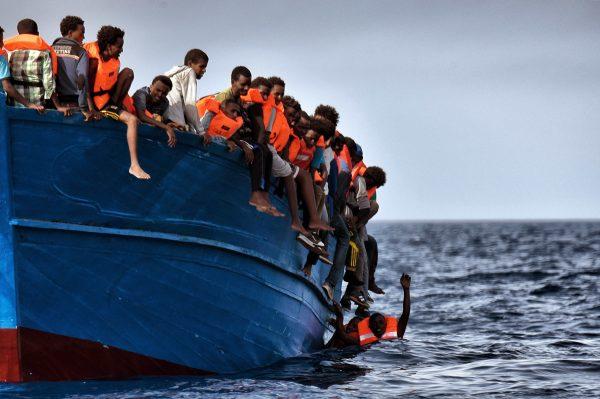 Migrants wait to be rescued as they drift in the Mediterranean Sea in a file photo. (Aris Messinis/AFP/Getty Images)
