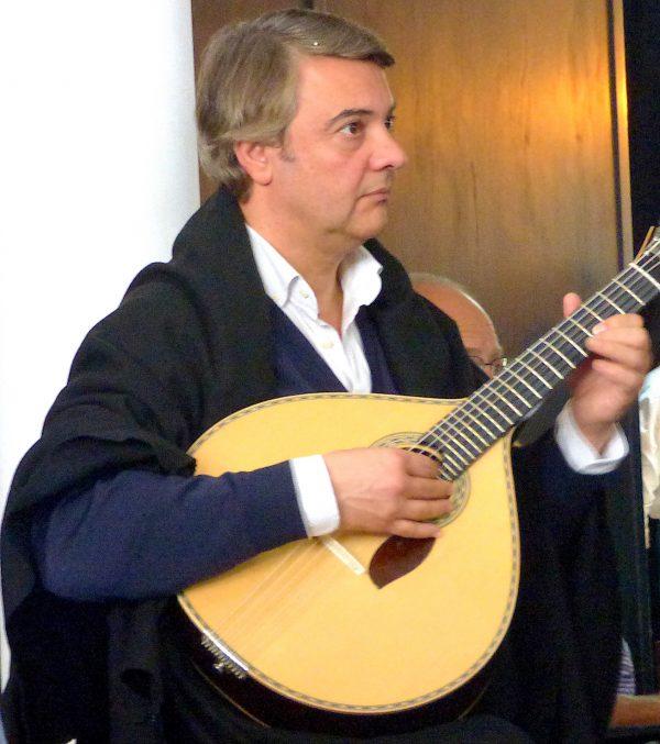 A Fado singer with his Portuguese guitar at Coimbra University's República. (Manos Angelakis)