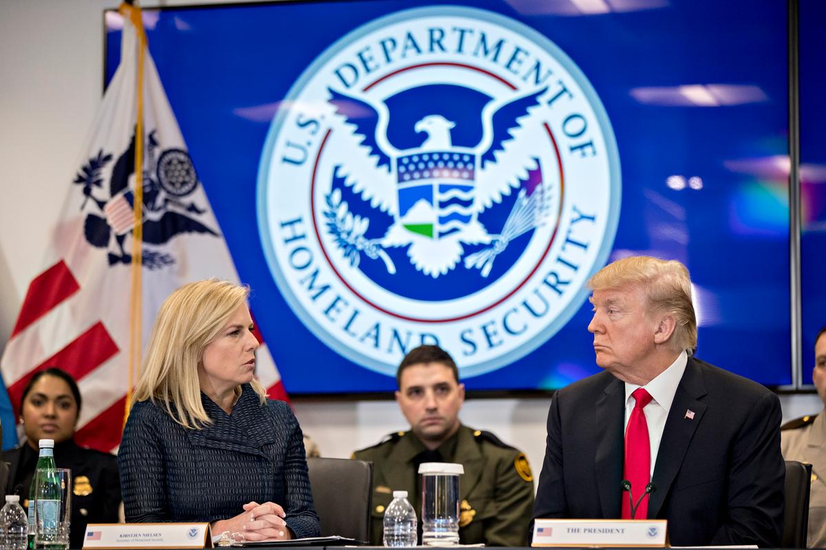 Secretary of Homeland Security Kirstjen Nielsen (L) talks to President Donald Trump during a Customs and Border Protection roundtable in Sterling, Va., on Feb. 2, 2018. (Andrew Harrer-Pool/Getty Images)