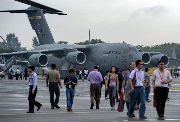 Visitors look at a US Air Force Boeing C-17 Globemaster III military transport aircraft on display at a previous Singapore Airshow on February 19, 2016. (Roslan Rahman/AFP/Getty Images)