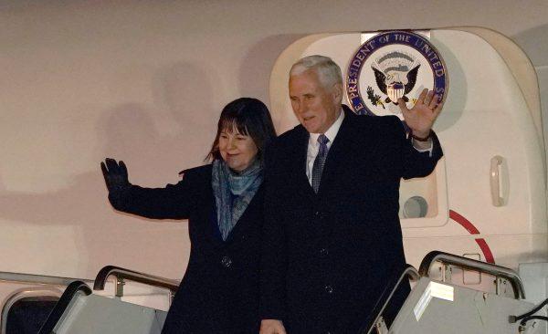 U.S. Vice President Mike Pence and his wife Karen wave upon his arrival at Yokota Air Base on the outskirts of Tokyo, Japan Feb. 6, 2018. (Reuters/Shizuo Kambayashi/Pool)