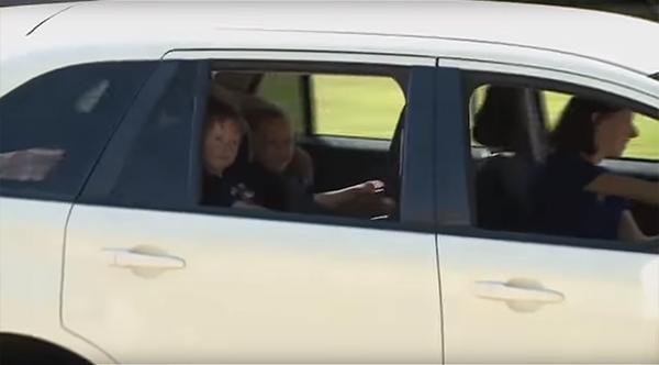 On the road again in her repaired Ford Edge with her children in the back seat—Liz Laird only had to wait from July to September to see things set right. (CBS13 screenshot)