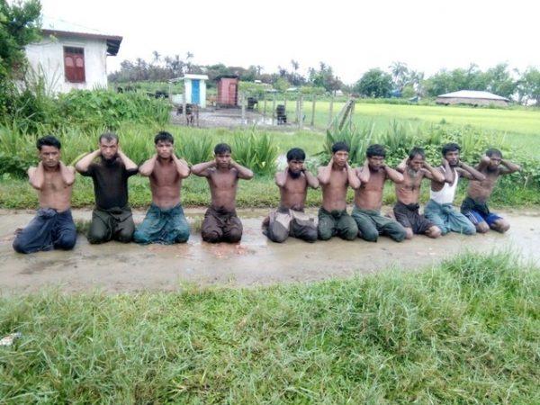 Ten Rohingya Muslim men with their hands bound kneel in Inn Din village Sept. 1, 2017. (Handout via Reuters)