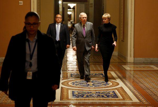Senate Majority Leader Mitch McConnell walks to the Senate floor before a vote to end a government shutdown on Capitol Hill in Washington, U.S., Feb. 9, 2018. (Reuters/Joshua Roberts)