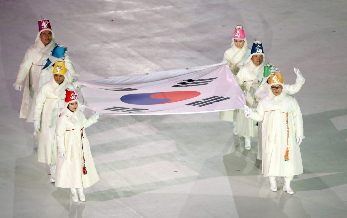 Performers carry the South Korean flag during the opening ceremony of the Pyeongchang 2018 Winter Olympics in the Pyeongchang Olympic Stadium, Pyeongchang, South Korea, on Feb. 9, 2018. REUTERS/Sean M. Haffey