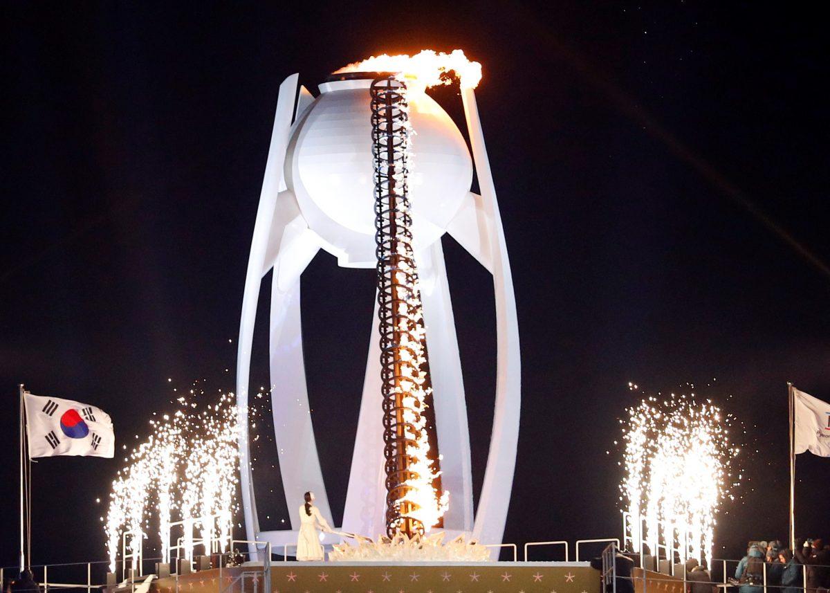Former figure skater Yuna Kim of South Korea lights the cauldron during the opening ceremony of the Pyeongchang 2018 Winter Olympics in the Pyeongchang Olympic Stadium, Pyeongchang, South Korea, on Feb. 9, 2018. (Reuters/Phil Noble)
