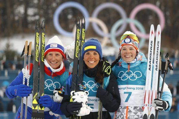 Charlotte Kalla of Sweden, Marit Bjoergen of Norway and Krista Parmakoski of Finland during the prize ceremony. (Reuters/Kai Pfaffenbach)