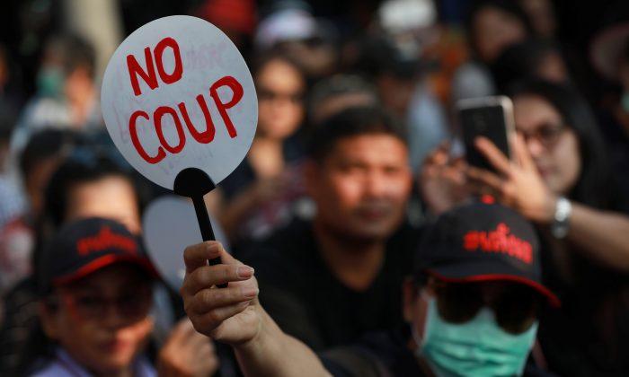 Hundreds Gather at Bangkok’s Democracy Monument to Demand Election