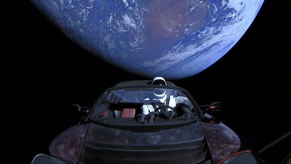 In this handout photo provided by SpaceX, a Tesla roadster launched from the Falcon Heavy rocket with a dummy driver named "Starman" heads toward Mars. (SpaceX via Getty Images)