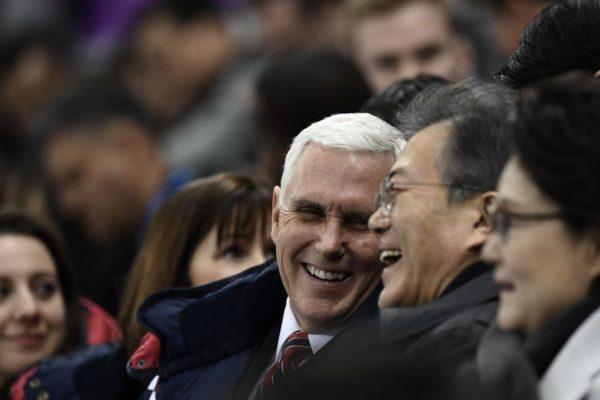 Vice President Mike Pence (C) talks to South Korea's President Moon Jae-in during the short track speed skating event during the Pyeongchang 2018 Winter Olympic Games, at the Gangneung Ice Arena in Gangneung on Feb. 10, 2018. (Aris Messinis/AFP/Getty Images)