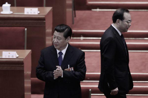 Sun Zhengcai walks behind Chinese leader Xi Jinping (L) as they attend a session of the National People's Congress at the Great Hall of the People in Beijing, China on March 15, 2013. (Feng Li/Getty Images)