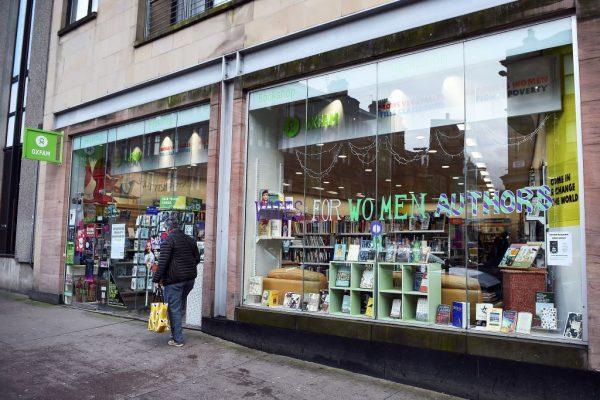 A man walks past the front of an Oxfam bookshop in Glasgow on February 10, 2018.<br/>(Andy Buchanan/AFP/Getty Images)