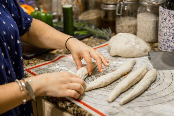 Shaping the challah dough. (Samira Bouaou/The Epoch Times)