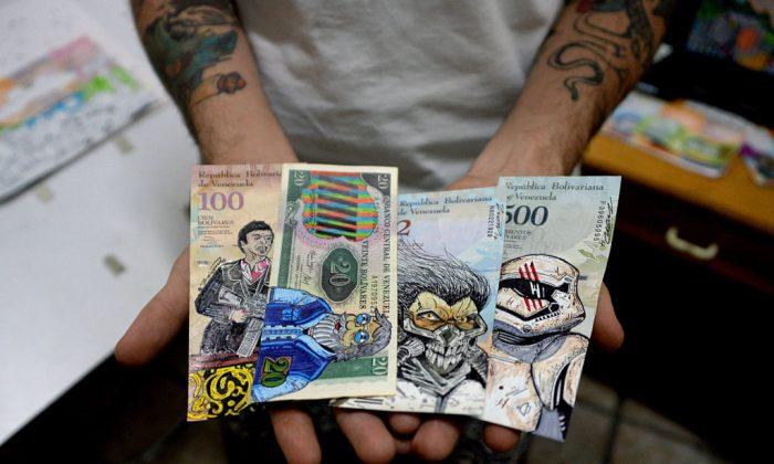 Jose Leon, 26, shows his artwork painted on devalued bolivar bills, at his workshop in San Cristobal, Venezuela, on Feb. 2, 2018. (George Castellanos /AFP/Getty Images)