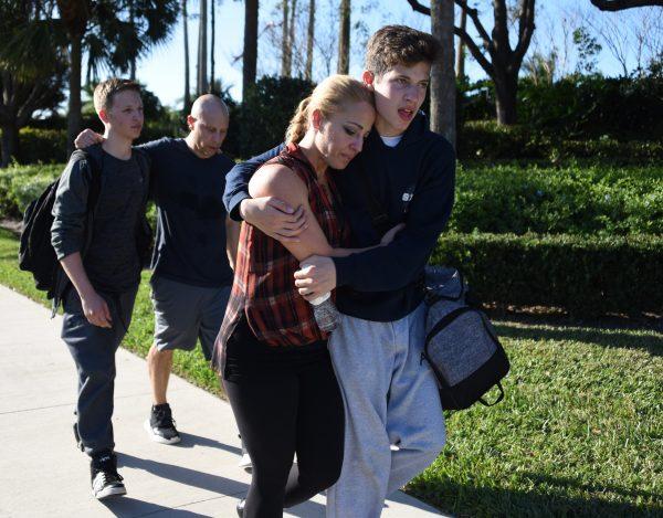 Students react following a shooting at Marjory Stoneman Douglas High School in Parkland, Fla., on Feb. 14, 2018. (Michele Eve Sandberg/AFP/Getty Images)