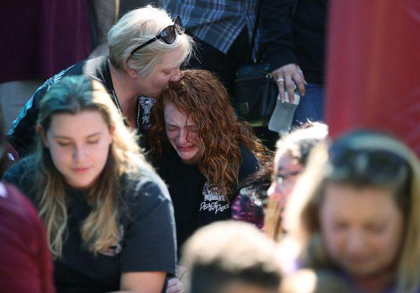 Alyssa Kramer (C), a Marjory Stoneman Douglas High School student, is comforted by her mother Tonja Kramer during a prayer vigil on February 15, 2018, in Parkland, Florida, one day after a mass shooting took place at the school. (Photo by Mark Wilson/Getty Images)