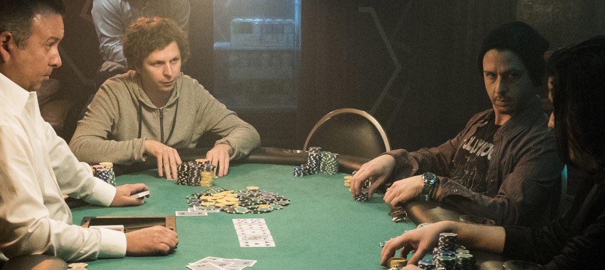 Michael Cera (2nd L) and Jeremy Strong (2nd R) star in “Molly’s Game.” (Michael Gibson/Motion Picture Artwork/STX Financing, LLC)