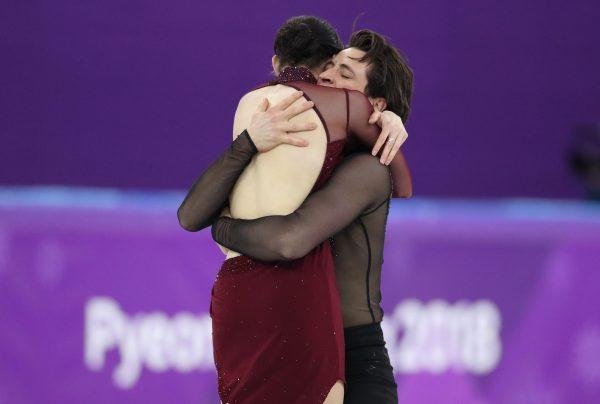 Canadians Tessa Virtue and Scott Moir react after their performance at the ice dance free dance competitions during the Pyeongchang 2018 Winter Olympics on Feb. 20, 2018. (Reuters/Lucy Nicholson)