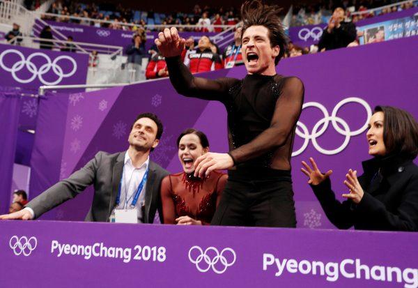 Tessa Virtue and Scott Moir react after their performance at the ice dance free dance competition final during the Pyeongchang 2018 Winter Olympics. (Reuters/John Sibley)