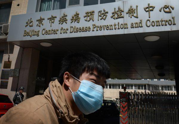 A man leaves the Beijing Center for Disease Prevention and Control on April 18, 2013. (Mark Ralston/AFP/Getty Images)