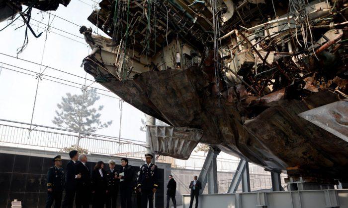 U.S. Vice President Mike Pence examines damage to the Cheonan which was sunk by a North Korean torpedo off the coast of Baekyong Island in 2010, on February 9, 2018 in Pyeongtaek, South Korea. (Woohae Cho/Getty Images)