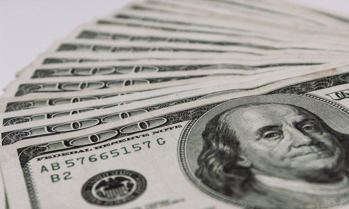 Volunteer Finds $4,000 in Old Book, Tracks Down Owner to Return Money