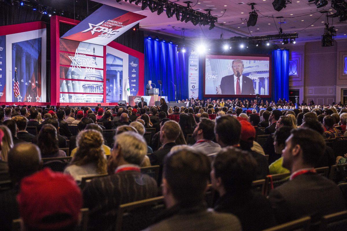 Audience members listen to  President Donald Trump as he addresses the Conservative Political Action Conference (CPAC) in National Harbor, Md., on Feb. 23, 2018. (Samira Bouaou/The Epoch Times)