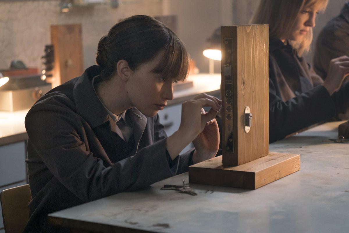 Jennifer Lawrence as a seductive Russian spy, learning lock picking, in 20th Century Fox’s “Red Sparrow.” (Murray Close/20th Century Fox Film Corporation)