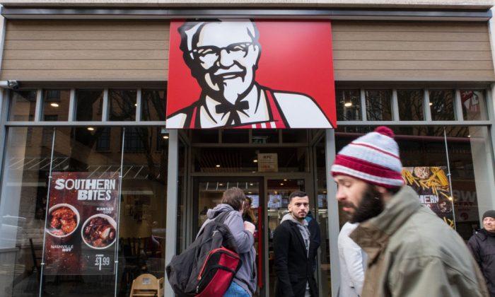 People pass a branch of KFC that is closed owing to problems with the delivery of chicken on Feb. 20, 2018 in Bristol, England. (Matt Cardy/Getty Images)