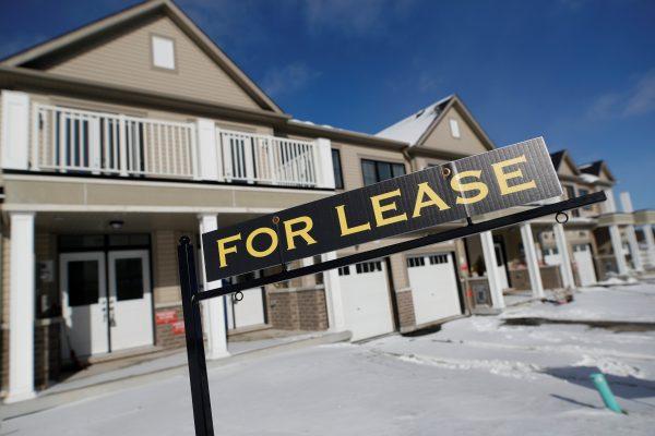 A "For lease" sign stands in front of a row of houses in a newly build subdivision in East Gwillimbury in the Greater Toronto Area on Jan. 30, 2018. (Reuters/Mark Blinch)