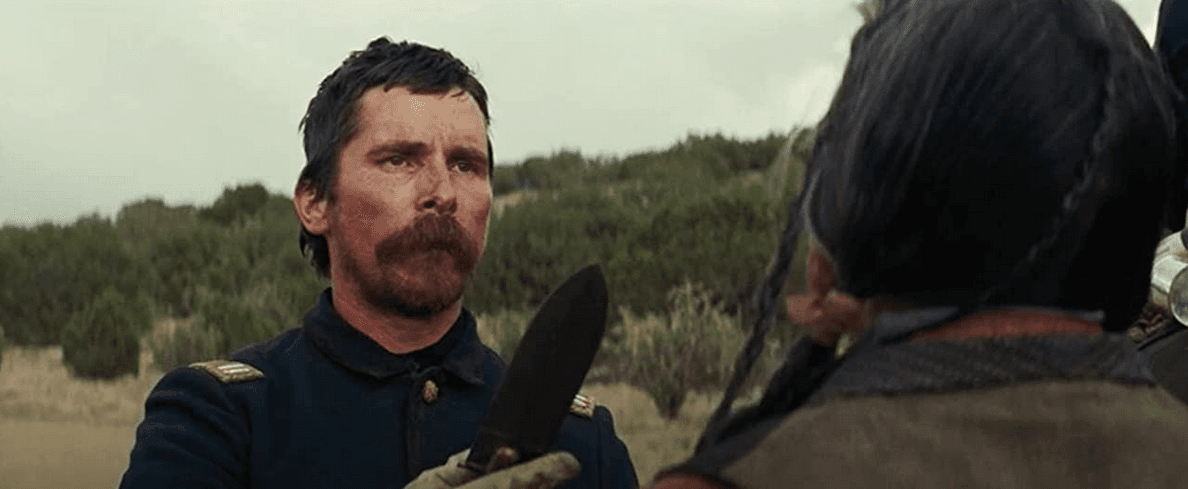 Capt. Joseph J. Blocker (Christian Bale, L) threatens Chief Yellow Hawk (Wes Studi) with a blade in “Hostiles.” (Lorey Sebastian/Yellow Hawk, Inc/Grisbi Productions, Le Waypoint Entertainment)