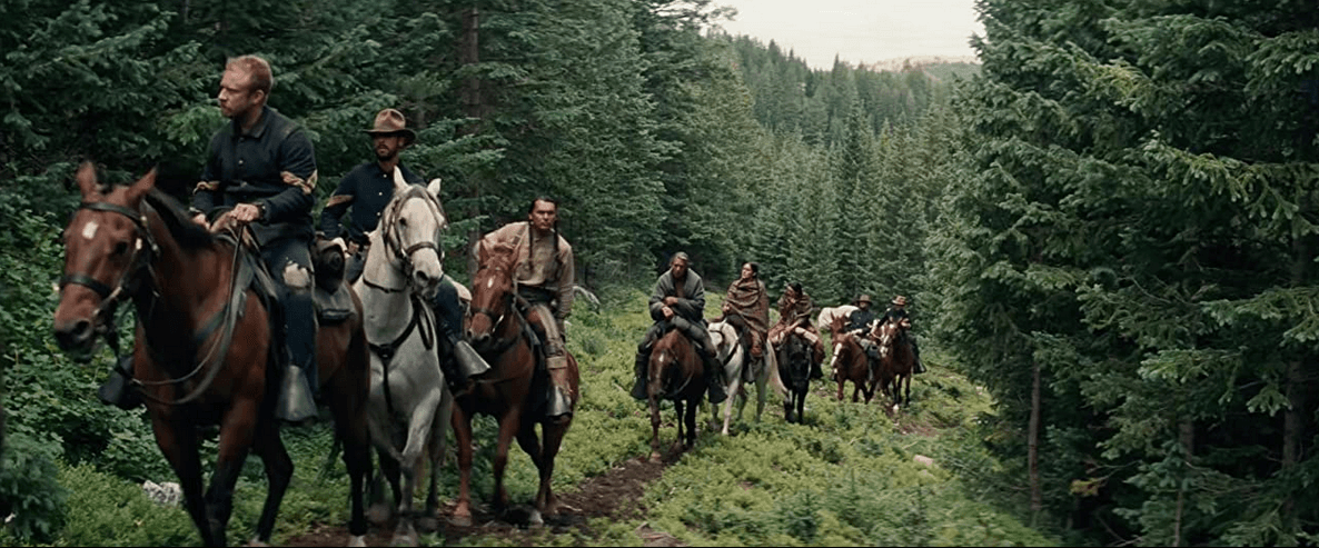Americans soldiers escort a Native American warrior and his family on horseback from New Mexico to Montana, in "Hostiles." (Lorey Sebastian/Yellow Hawk, Inc/Grisbi Productions, Le Waypoint Entertainment)