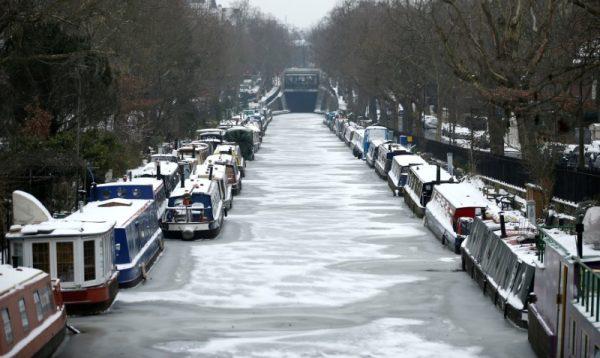 Canal boats are frozen at their berths on the Regent's Canal in Maida Vale in London, Britain, March 1, 2018. (Reuters/Henry Nicholls)