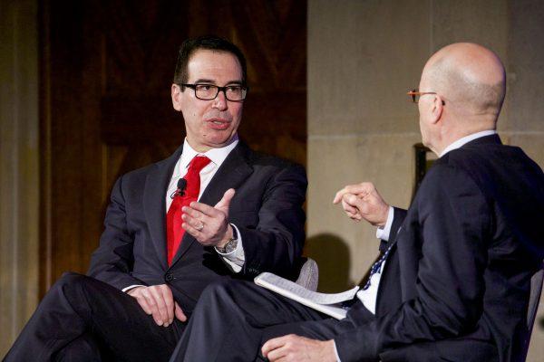 Secretary of the Treasury Steven Mnuchin (L) speaks with John Bussey, Associate Editor for The Wall Street Journal, at the 3rd Annual Invest in America! Summit at the U.S. Chamber of Commerce in Washington on Feb. 27, 2018. (Samira Bouaou/The Epoch Times)