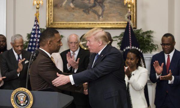 President Donald Trump shakes hands with Johnny Taylor, Jr. in the Roosevelt Room of the White House in Washington on Feb. 27, 2018. (Samira Bouaou/The Epoch Times)