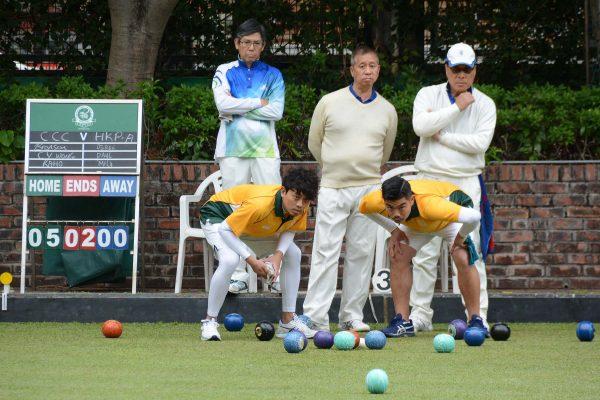 Craigengower Cricket Club’ Wong Chun Yat (left in yellow) and Bronson Fung closely monitor a bowl from their skipper Lee Ka Ho (not in photo) during the final league match against the Police. CCC won the game 6-2 to secure their third consecutive Triples League title. (Stephanie Worth)